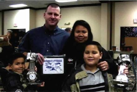 photo of family with Driver of the Year 		Award